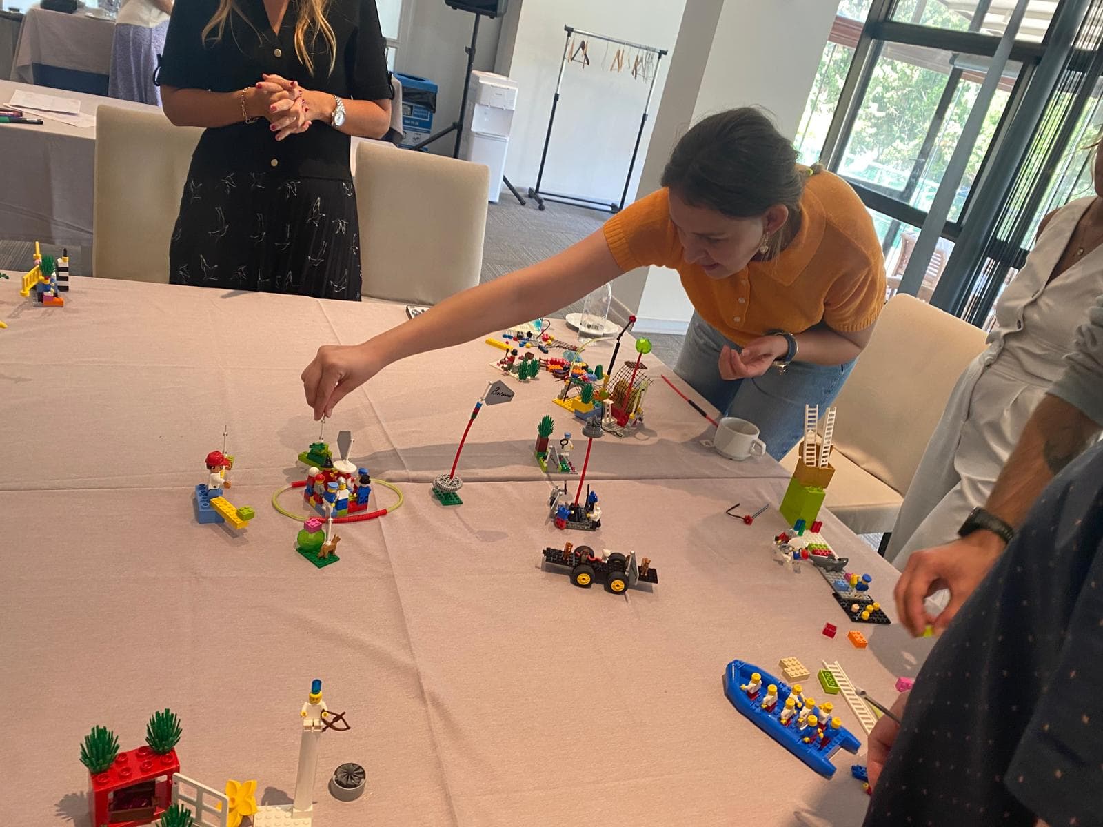 A participant placing her model onto the shared table